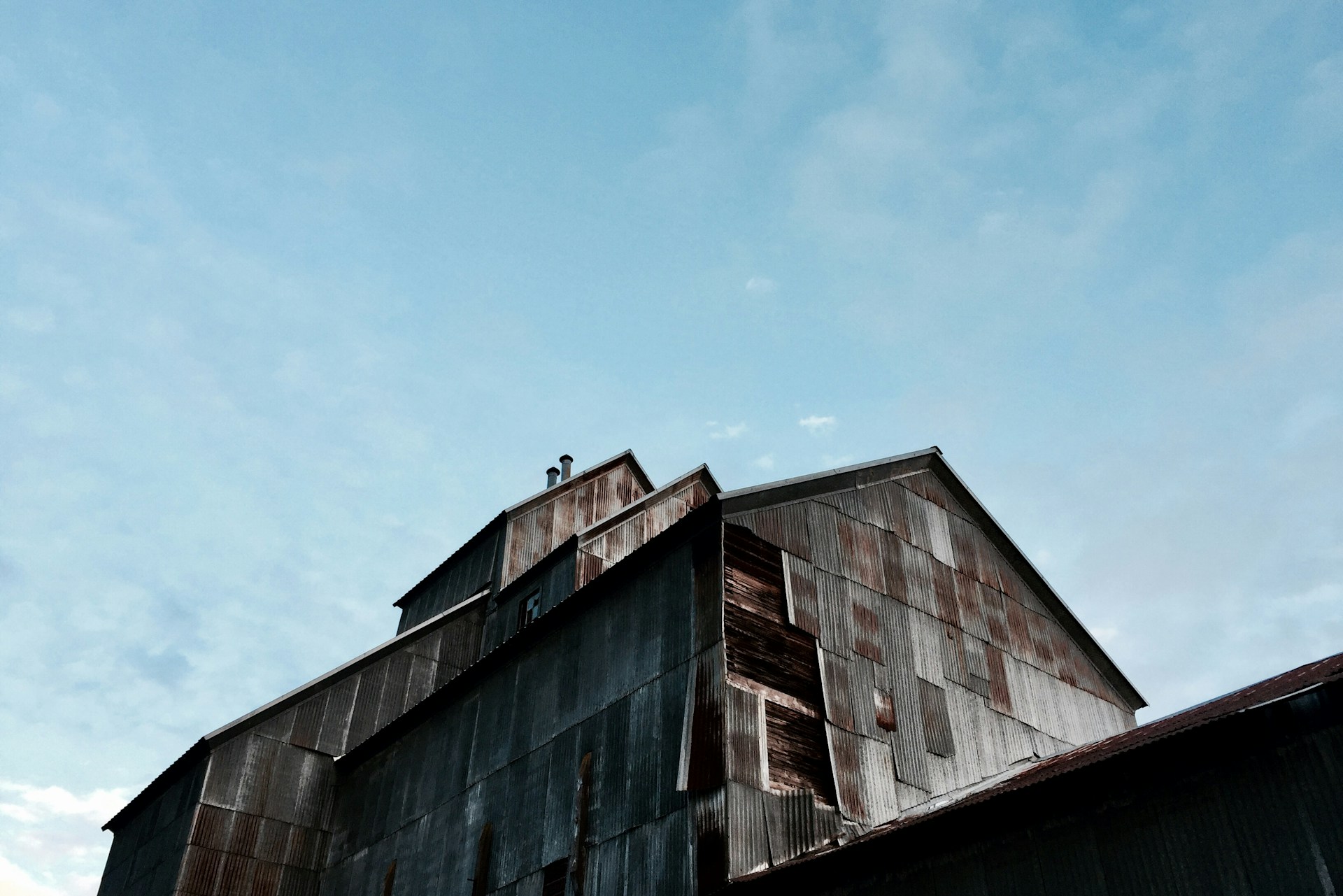woman wearing yellow long-sleeved dress under white clouds and blue sky during daytime
