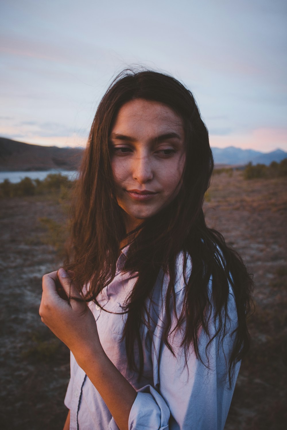 woman in white top facing camera