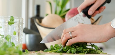 person cutting vegetables with knife