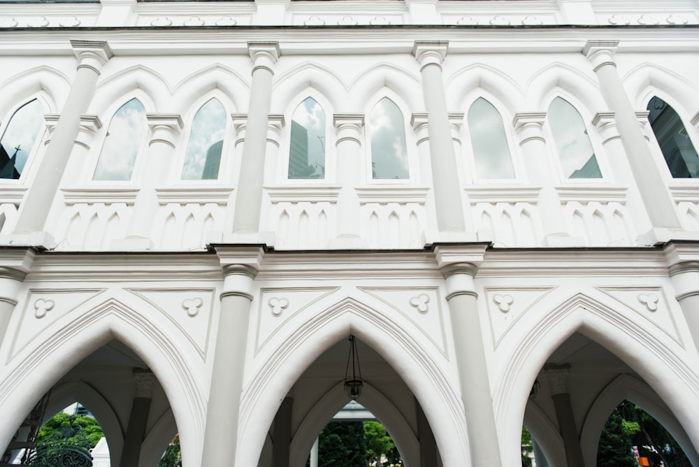 low angle photography of white concrete building during daytime