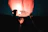 A gentle lantern glowing warmly against a twilight sky, symbolizing guidance.