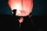 A gentle lantern glowing warmly against a twilight sky, symbolizing guidance.