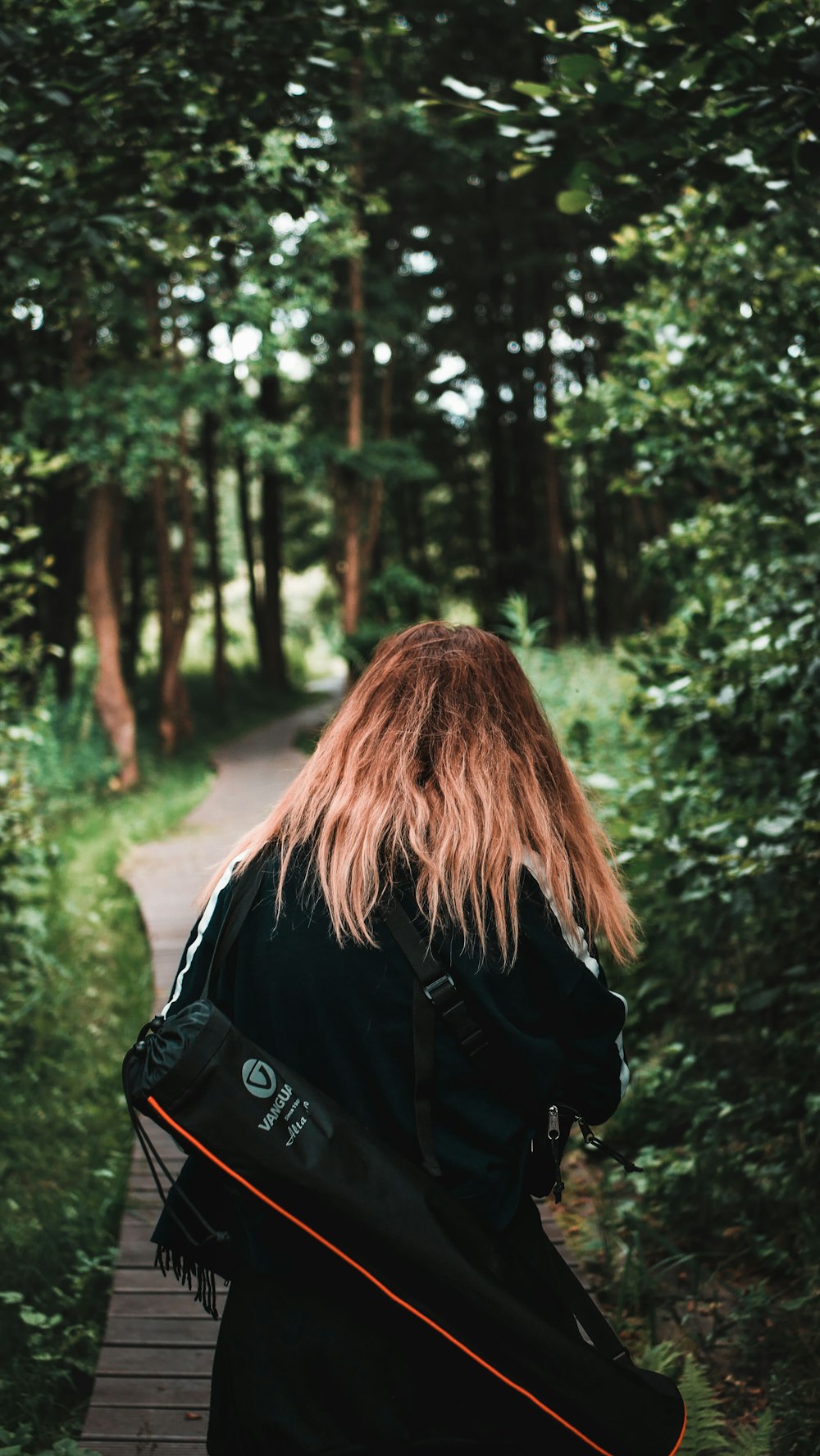 woman holding black bag