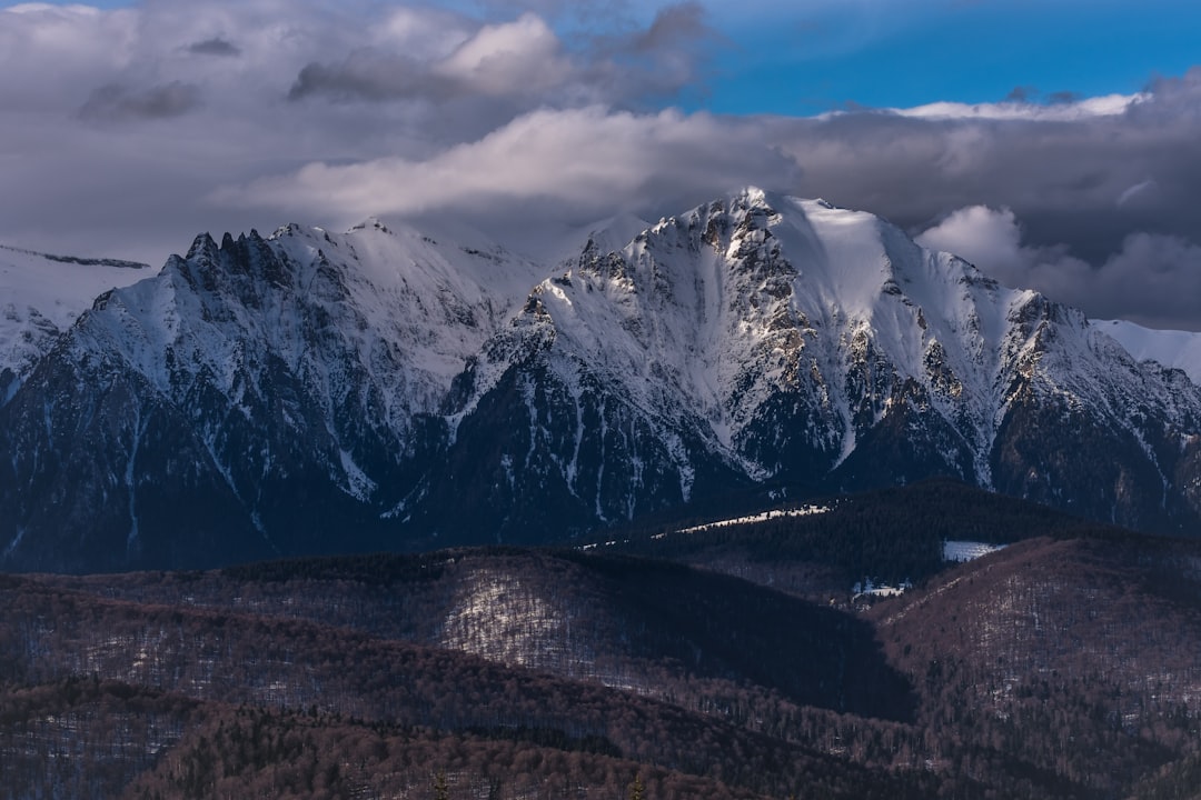 snow-capped mountain under gloomy sky