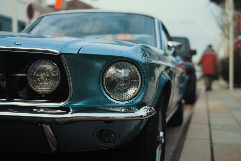 selective focus photo of blue car