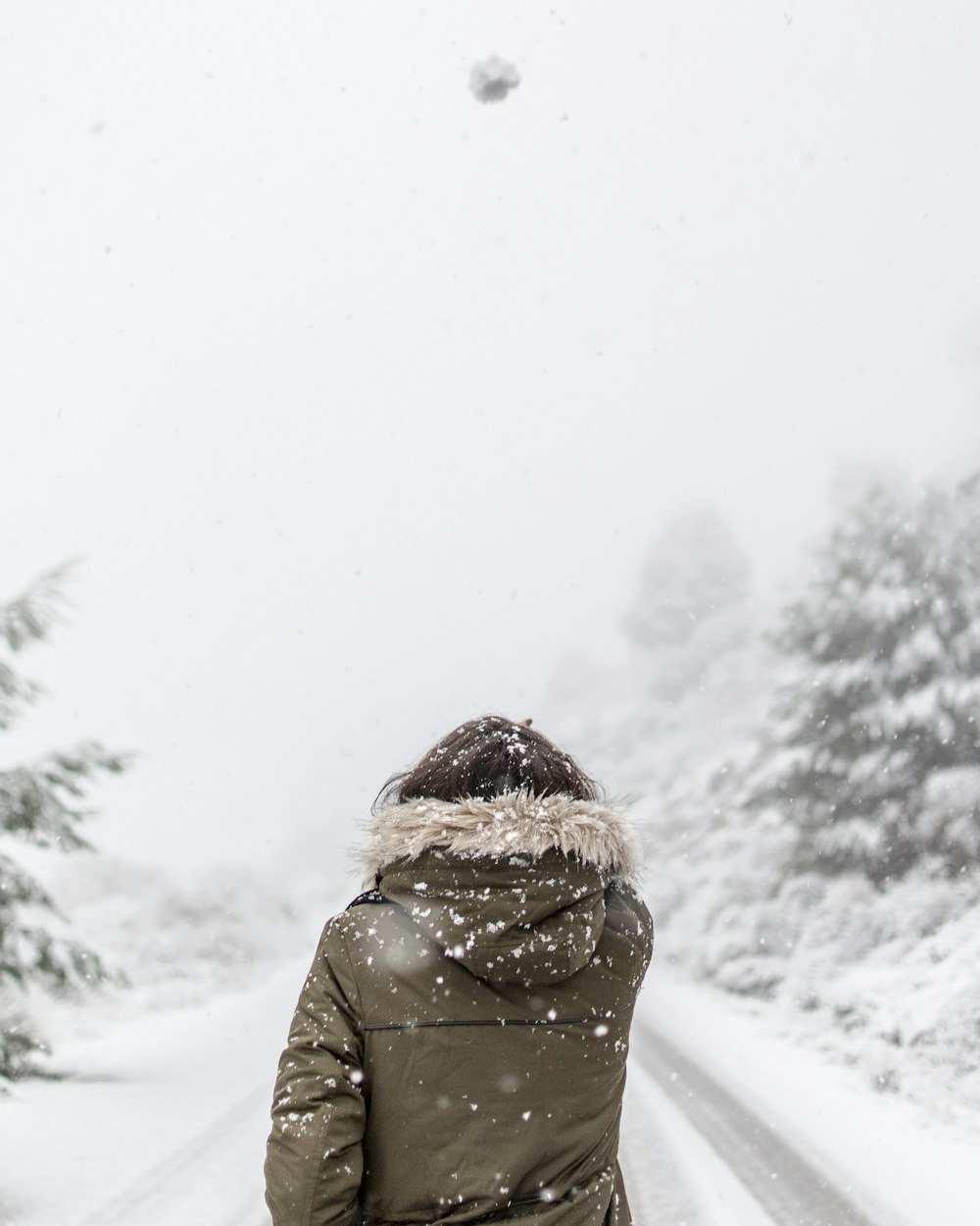 woman standing in front of road