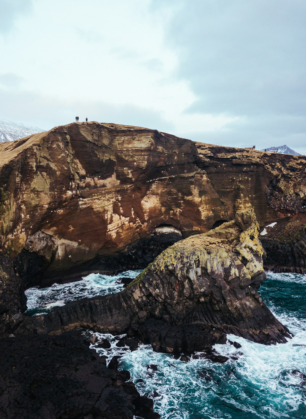 aerial photography of brown mountain near sea