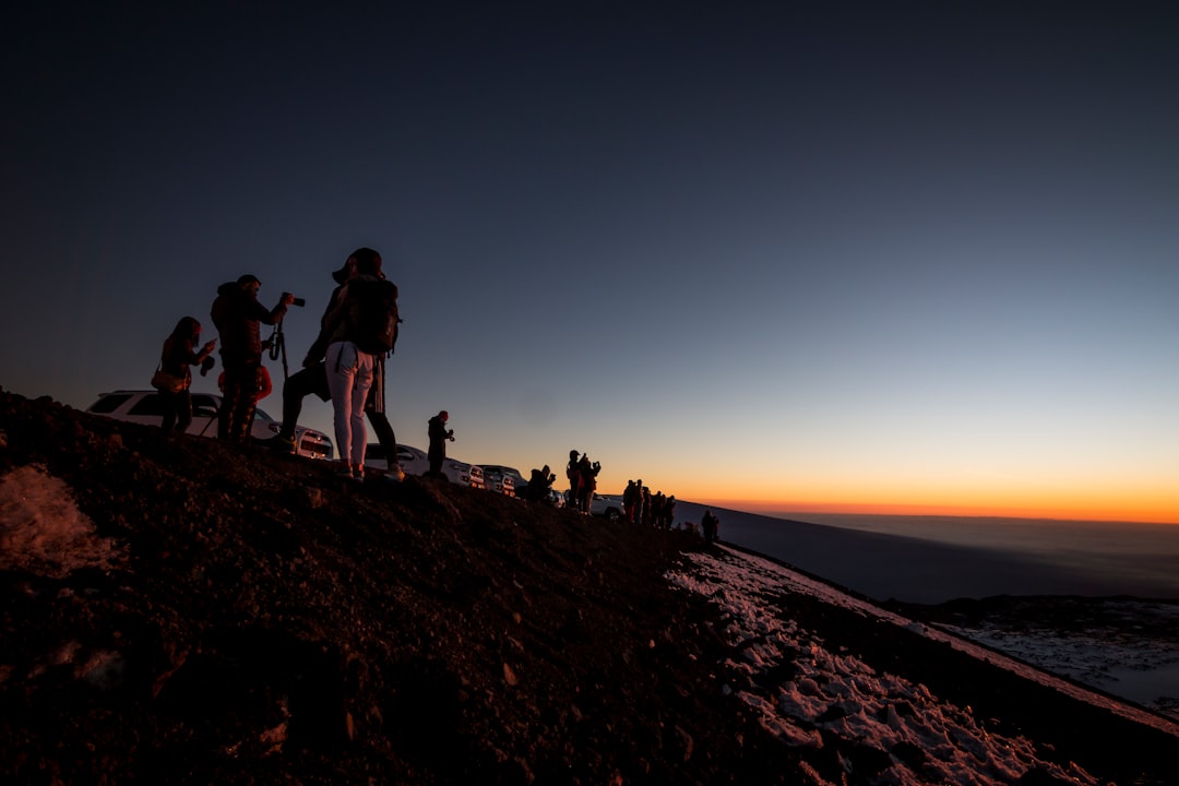 photo of people on top of the mountain