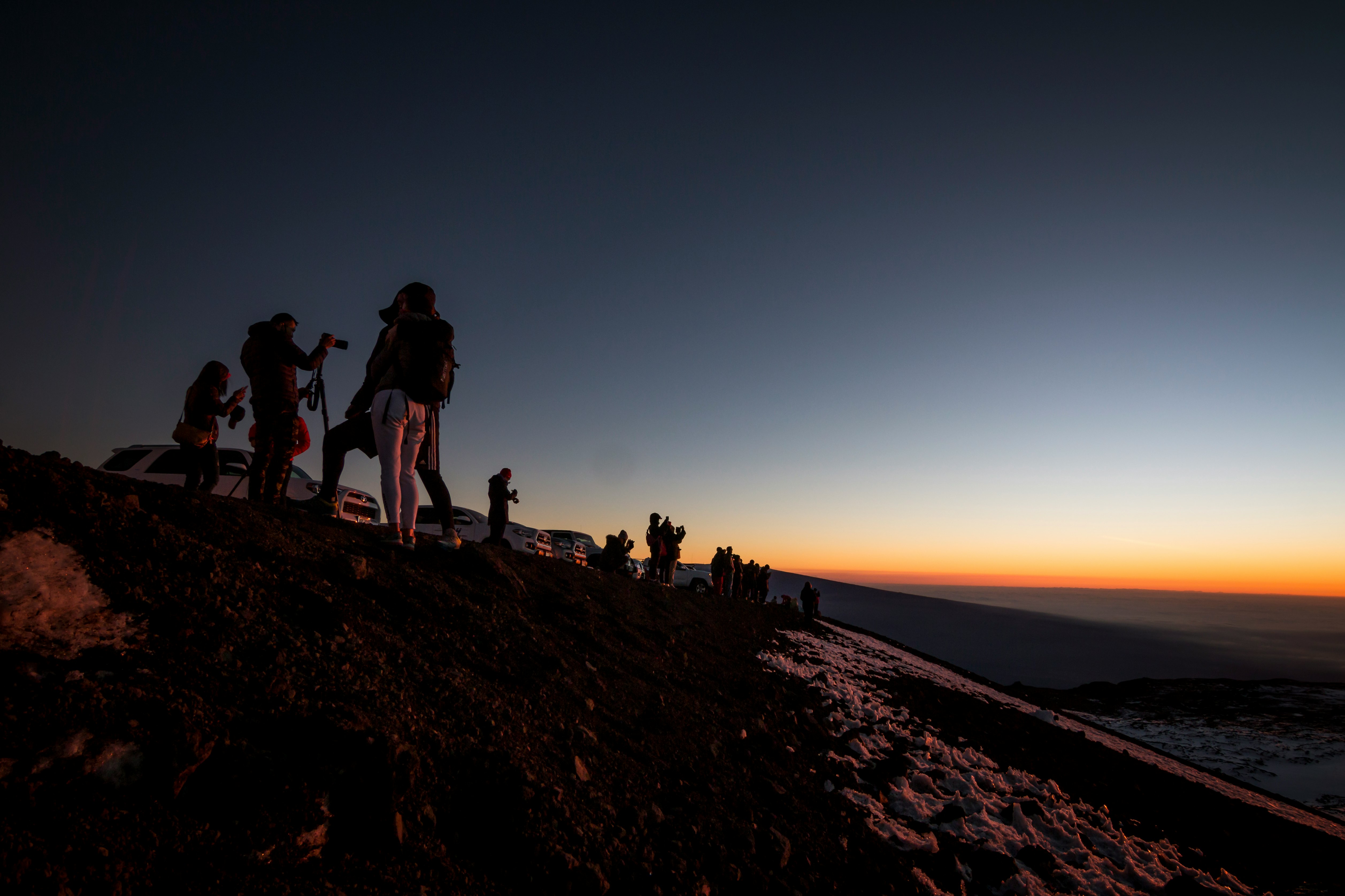 photo of people on top of the mountain