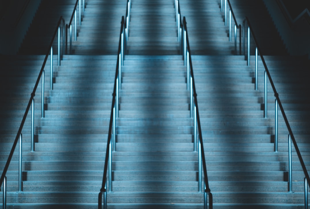 empty concrete stairs with metal handrail