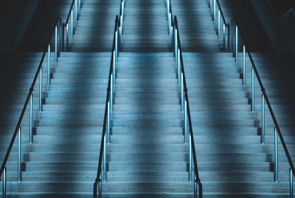 empty concrete stairs with metal handrail