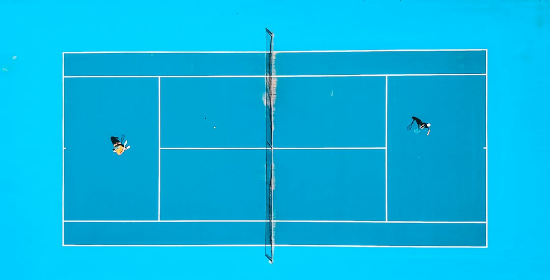 aerial photography of two person playing tennis, Father-Son Tennis