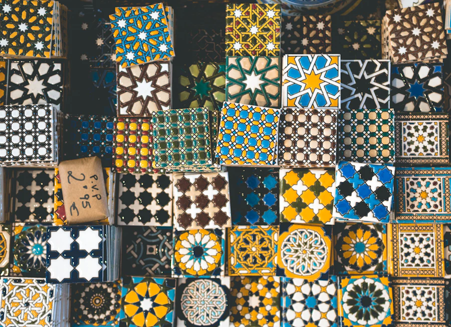 A craftsman shaping material by hand in the atelier
