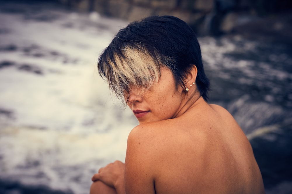 woman sitting while looking sideview