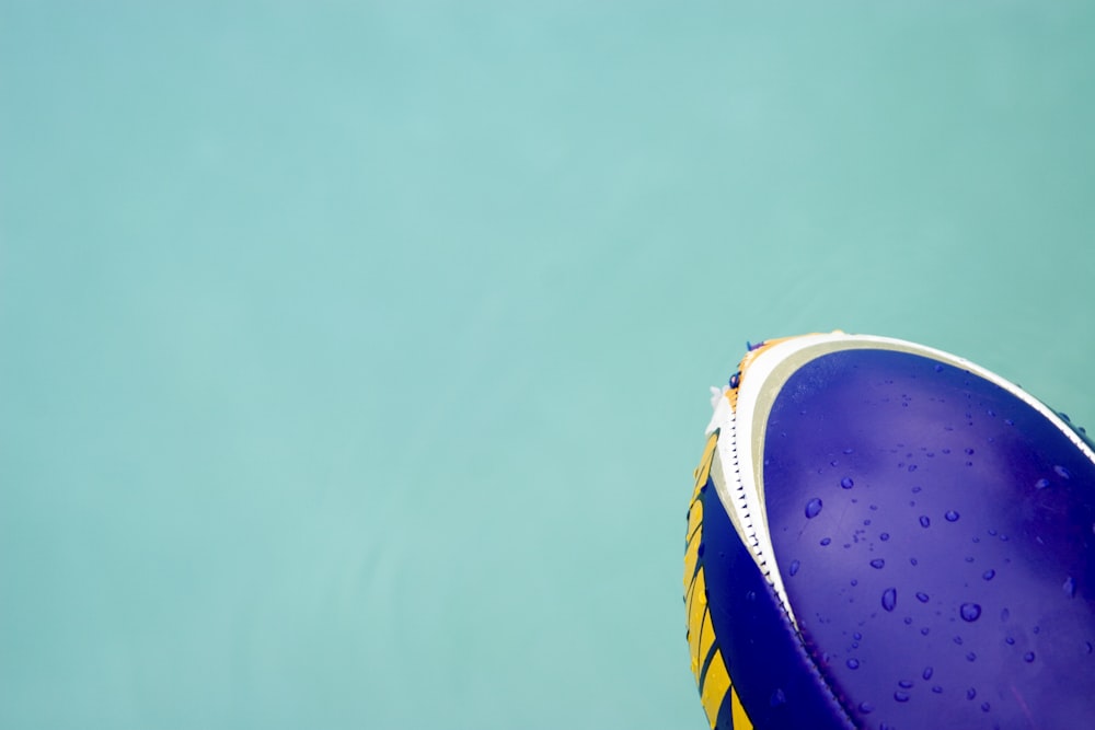 a close up of a blue and yellow frisbee