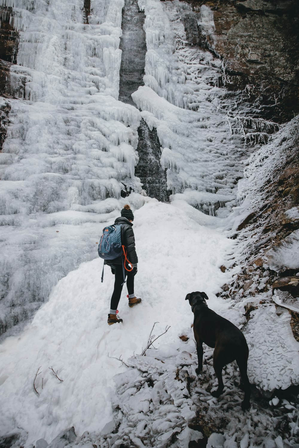 woman climbing through mountain