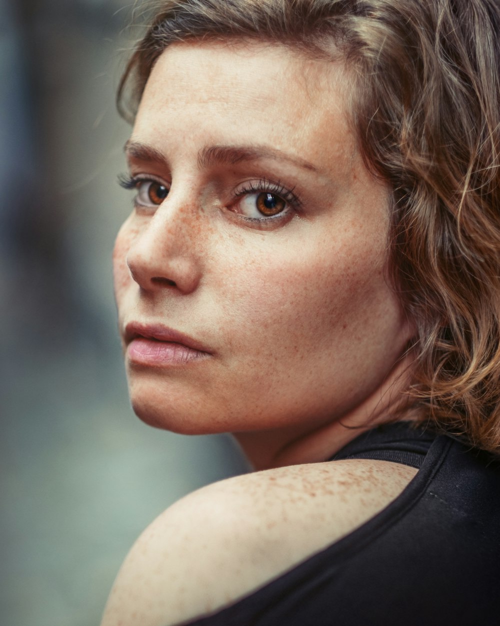 portrait photography of woman wearing black top