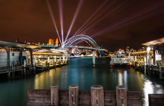 blue metal bridge near body of water at nighttime in Circular Quay Australia