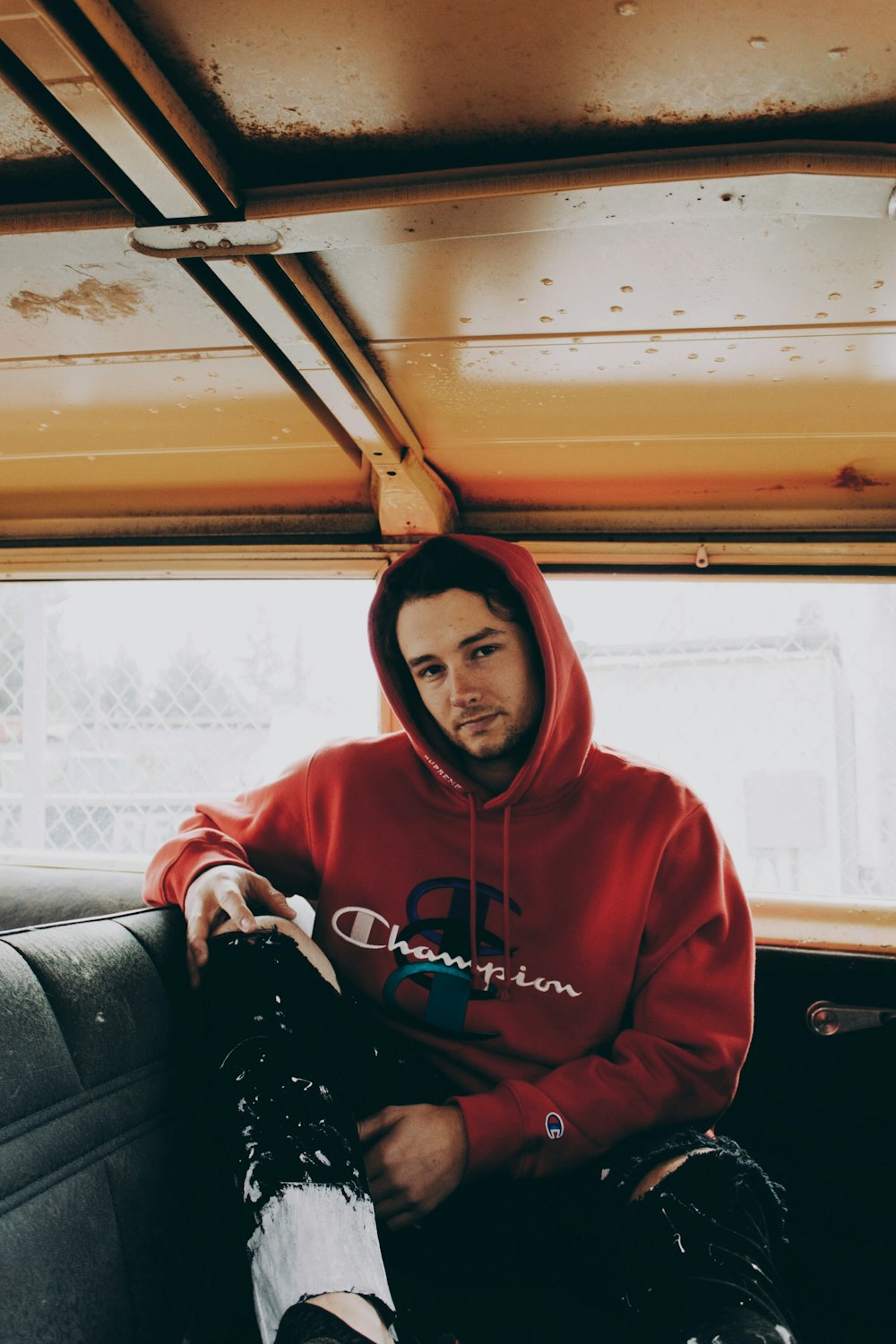 Man Sitting Inside Car With Legs On Car Seat Photo Free Human