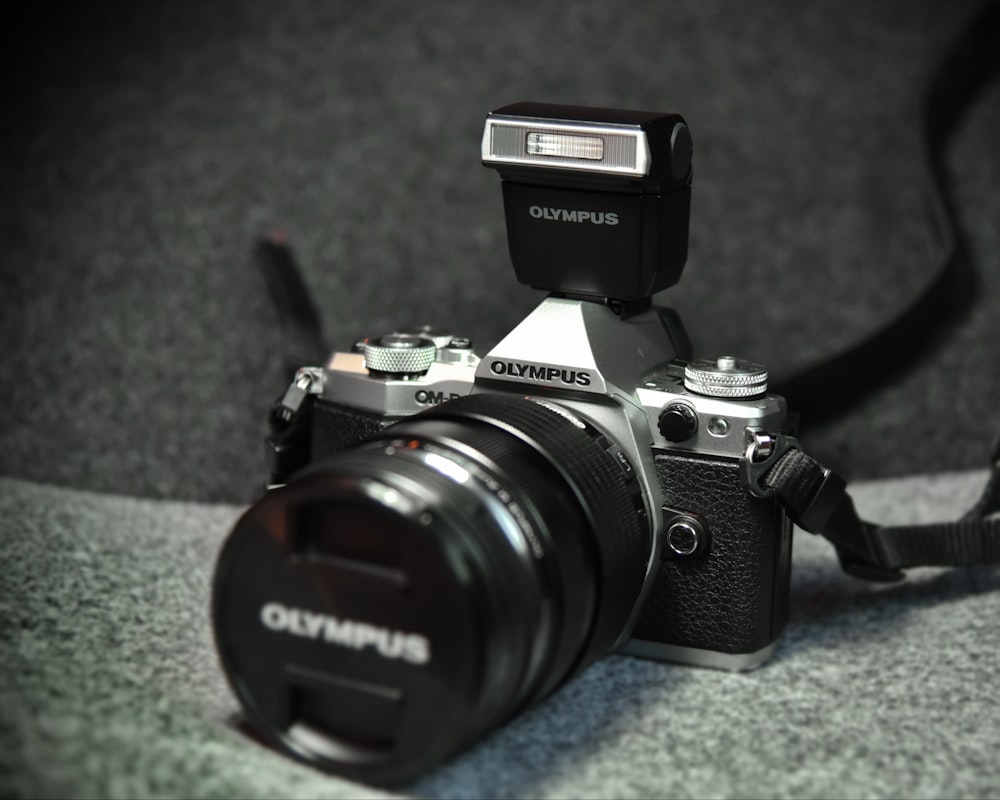 black and grey Olympus camera