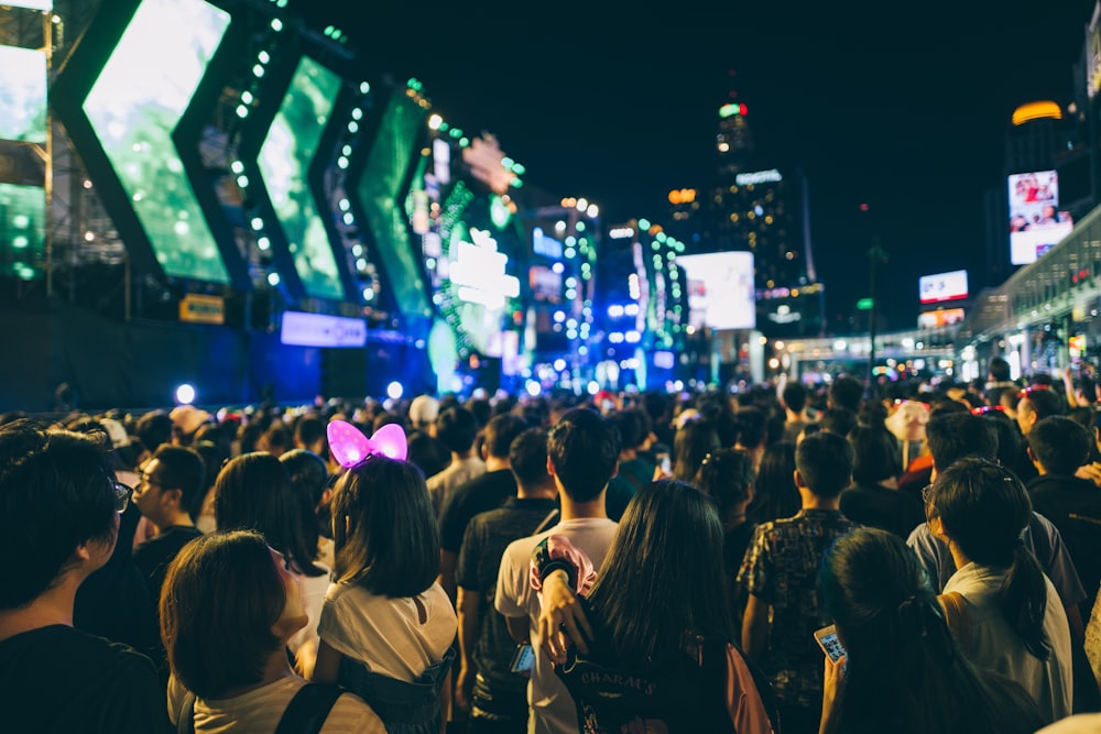 group of people in an area surrounded by buildings