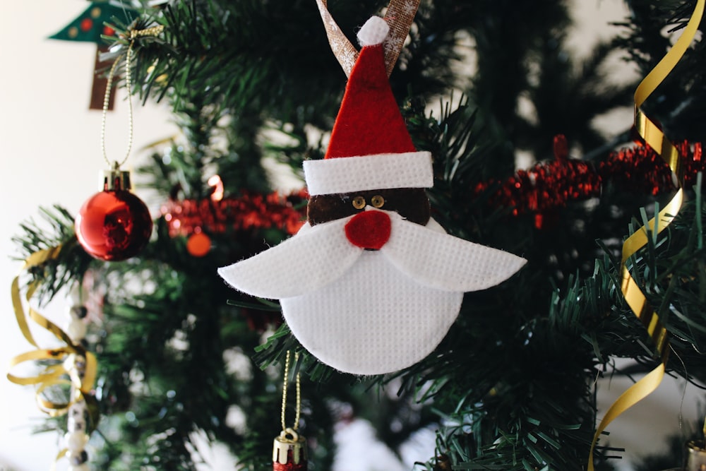 white and red Santa Claus head Christmas bauble