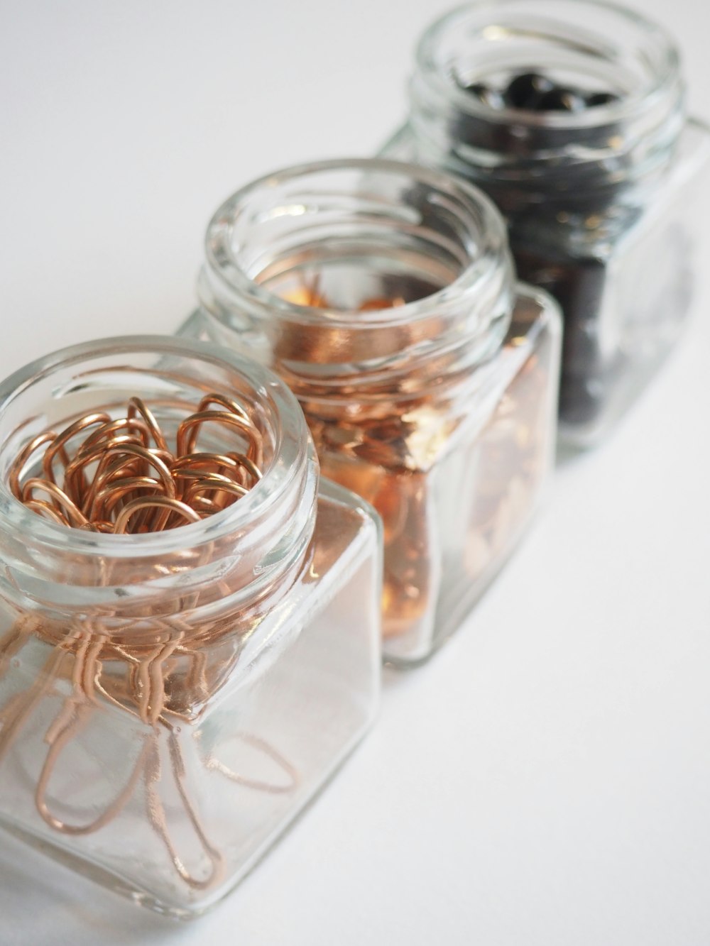 three clear glass containers