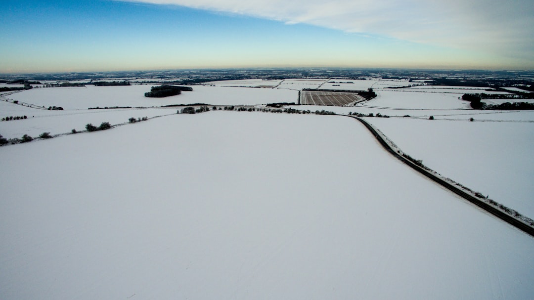 bird's eye photography of white field during day time