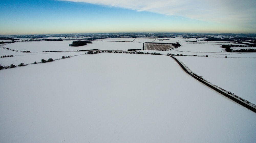 bird's eye photography of white field during day time