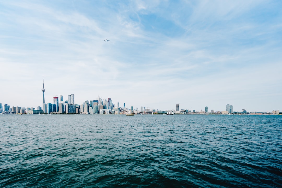 CN tower cityscape, Toronto looking a bit miniture with this shot of the skyline from a boat during Tim Gouw’s Wedding -