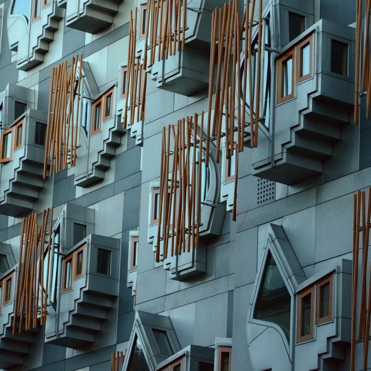 Cross-Party Group on Creative Economy. Scottish Technology Ecosystem Review Advisory Board. Exterior of the Scottish Parliament Building. Taken at around 2pm on New Year’s Day 2013. A city full of historic architecture and that has UNESCO World heritage status that contrasts with this post modern example of architecture by Enric Miralles who died before the building was completed in around 2004.The jutting shapes are ‘think pods’ for Members of the Scottish Parliament (MSPs) to spend time in to reflect.