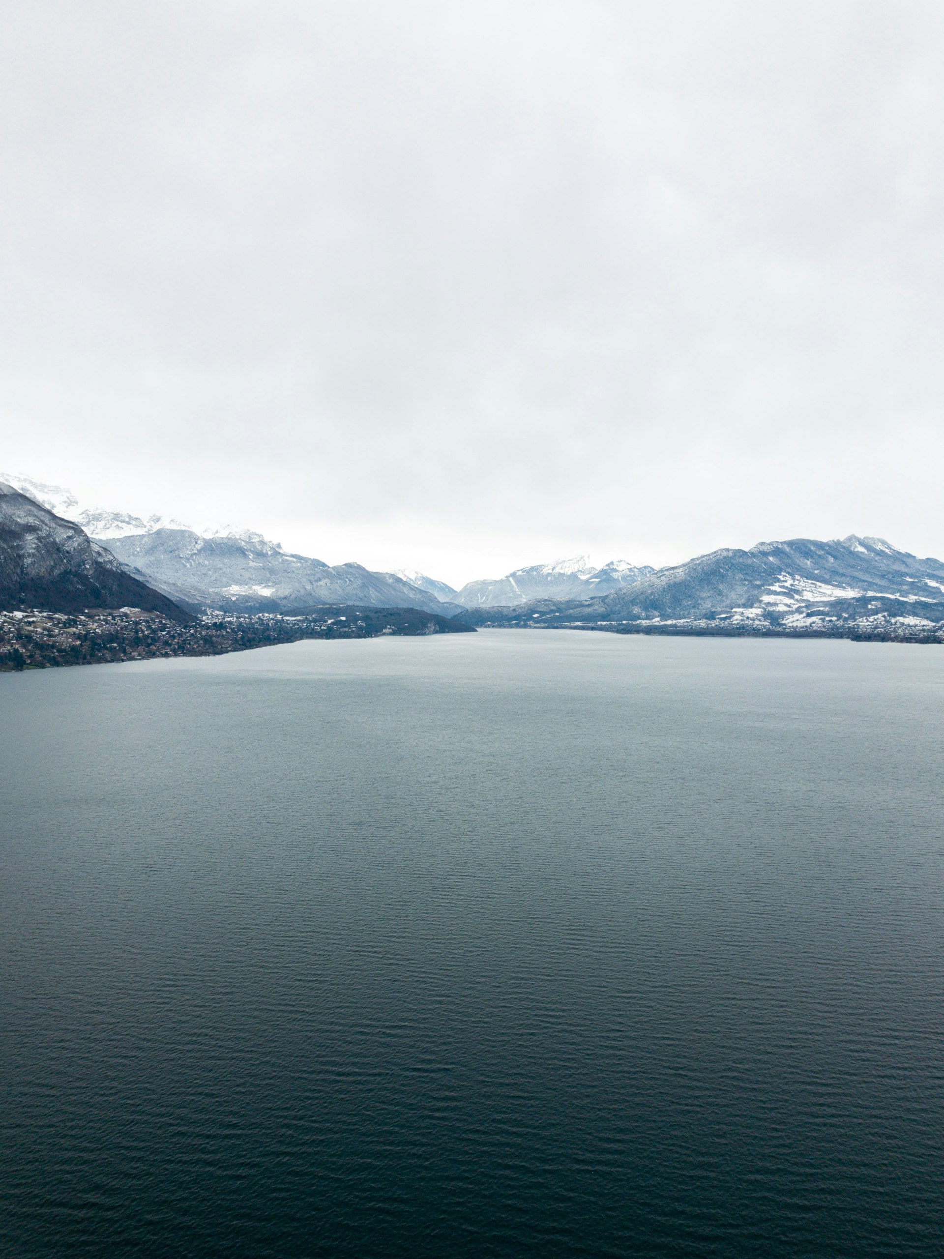 aerial view of body of water near mountain