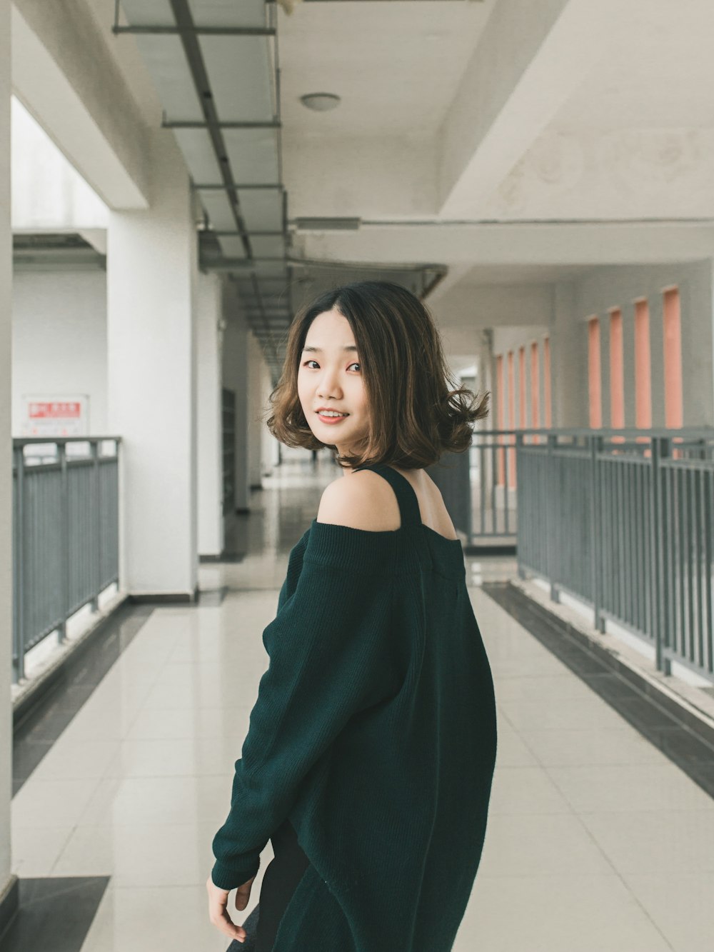 woman standing on hallway