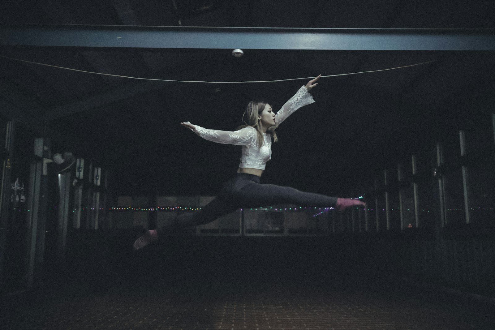 Canon EOS-1D X Mark II + Canon EF 16-35mm F4L IS USM sample photo. Woman jumping inside room photography