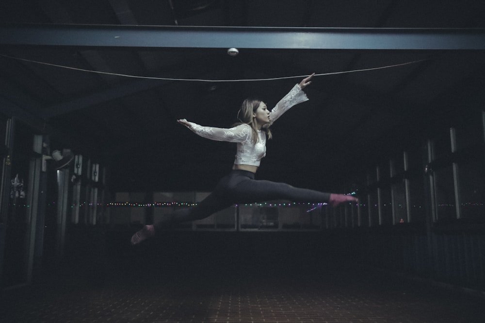 woman jumping inside room