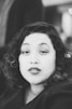 grayscale photo of woman wearing top