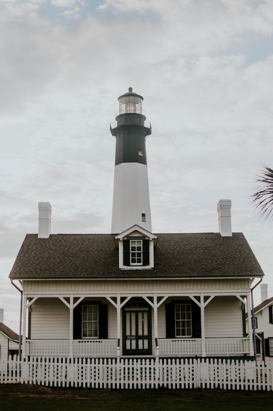 white lighthouse under white sky in Tybee Island Lighthouse United States