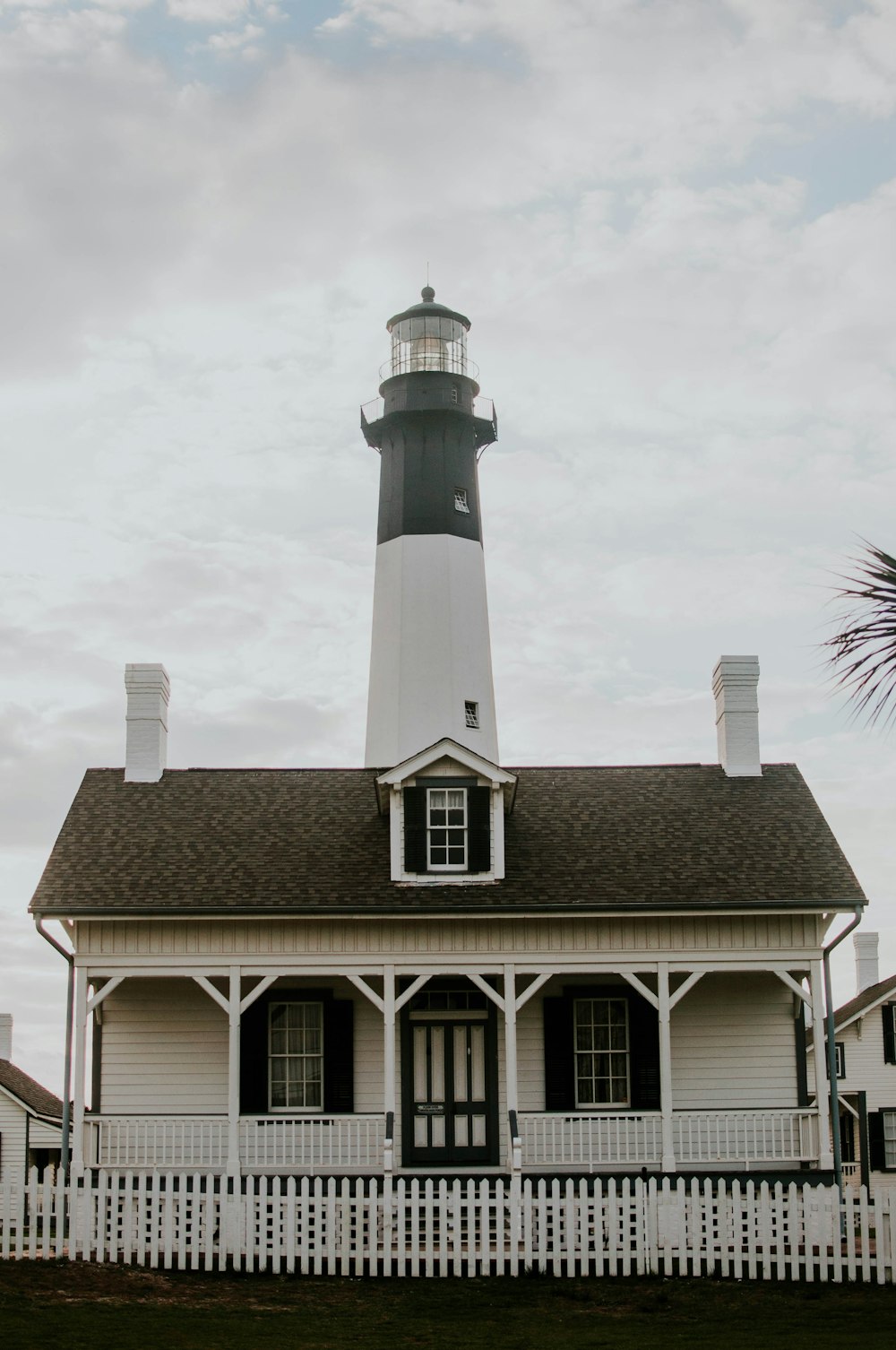 white lighthouse under white sky