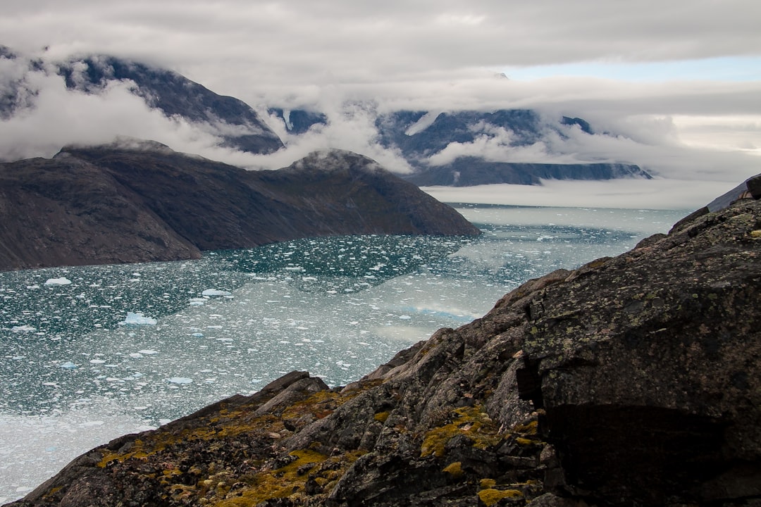 sea clouds and mountains, This photo was shot at «Mellem Landet» in greenland - quite a remote place. We were 3 hiking from Narsarsuaq and decide to go another 10 miles more «offroad» to see the beginning of the glacier. It was worth it.<p></figure>(name of the glacier: Qooqqup Sermia in Qooqqut fjord)