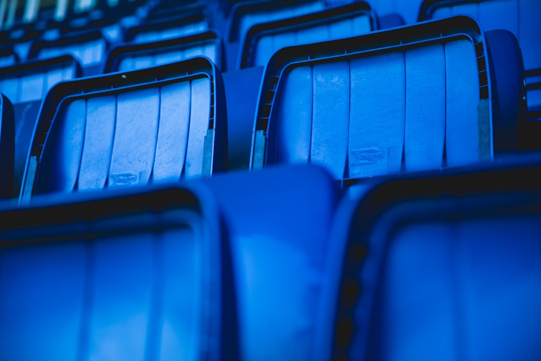 portrait photography of blue gang chair,