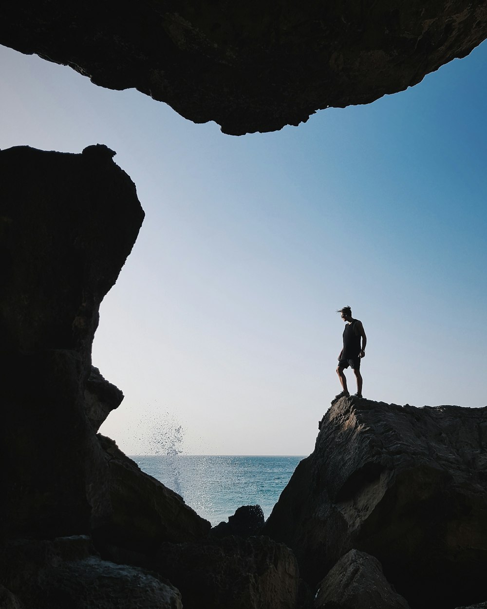 man standing near body of water at daytime