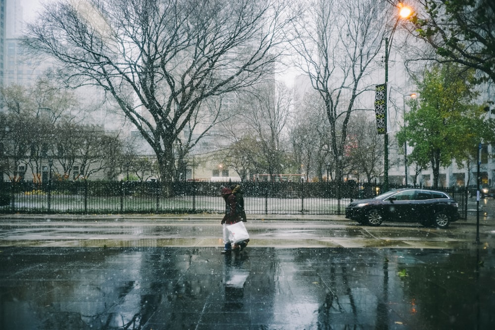 person standing on sidewalk