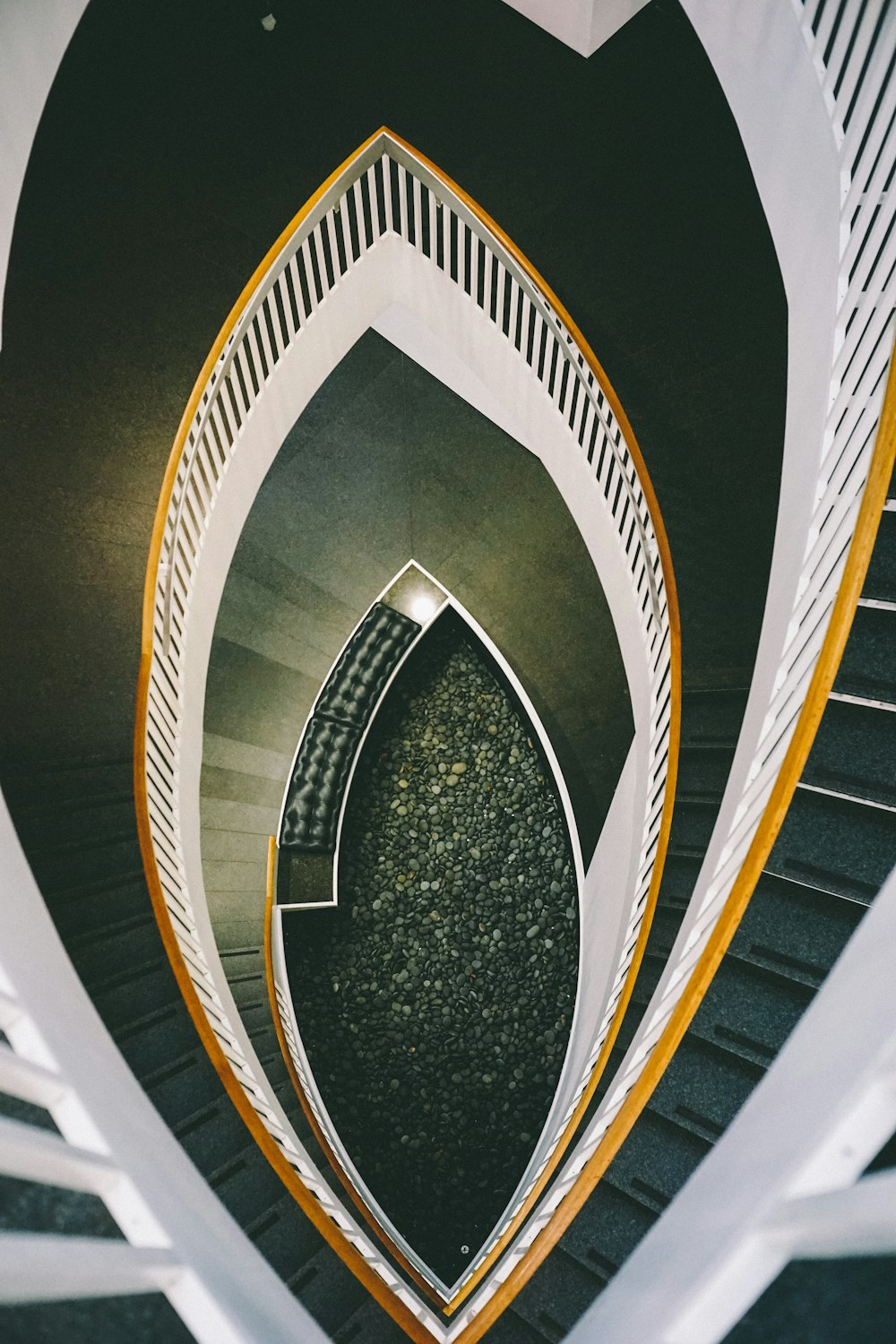 low-angle view of white spiral staircase