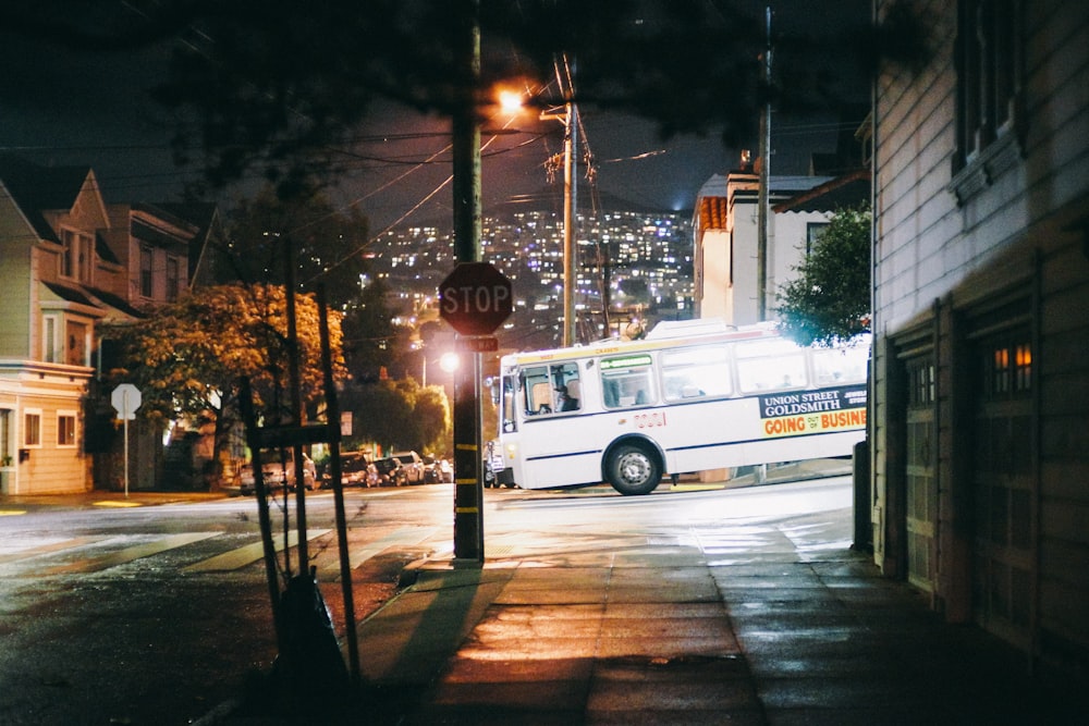 white bus near houses