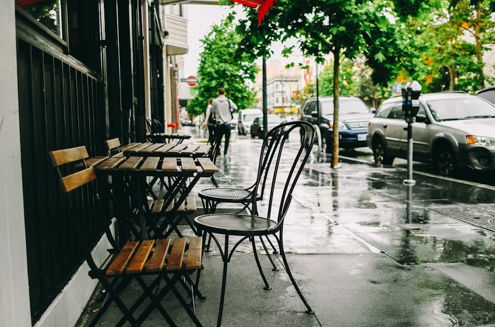 chairs and tables on sidewalk