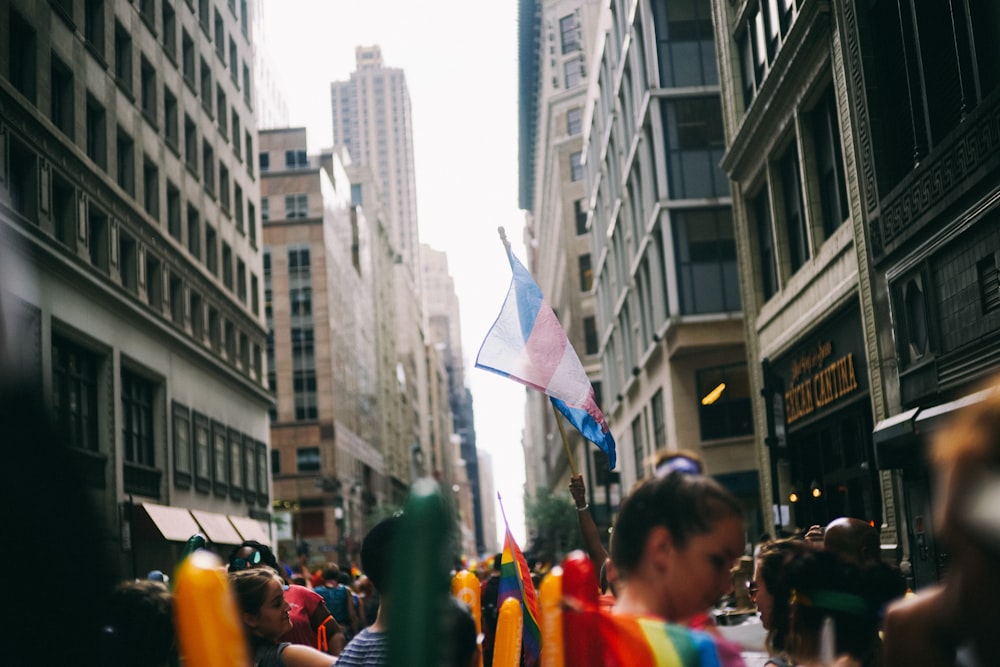 people on street holding flags