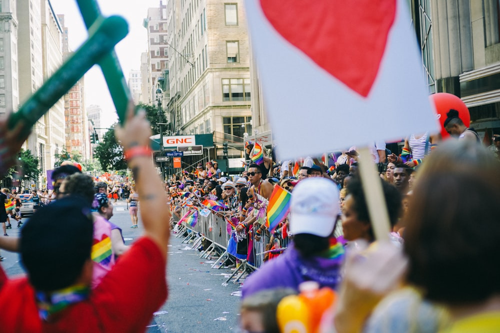 people parade on road at daytime