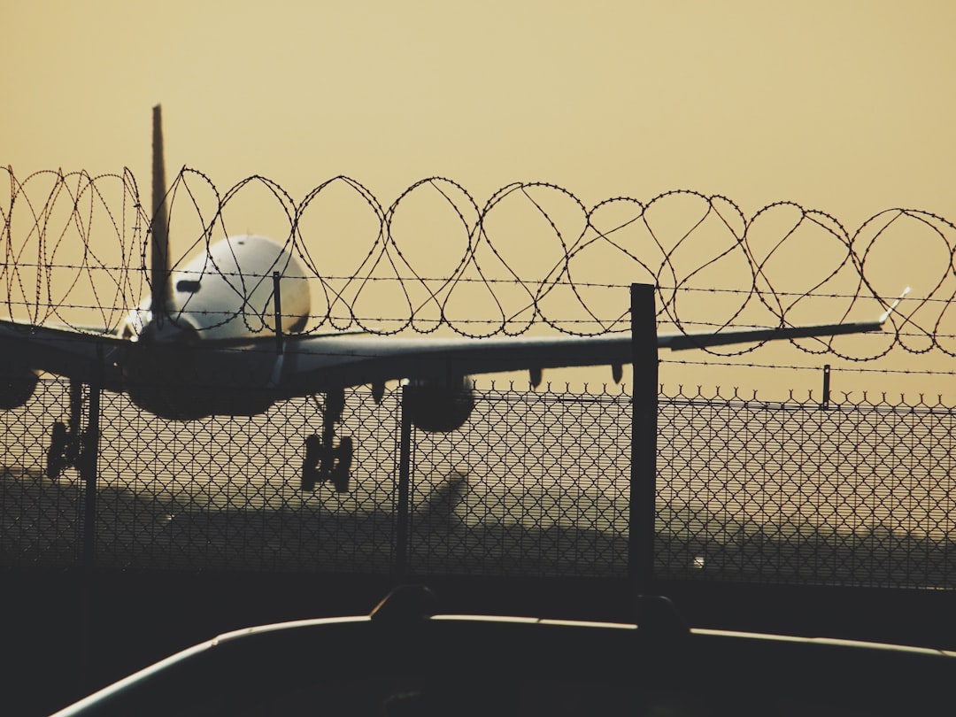 macro photography of white airplane,