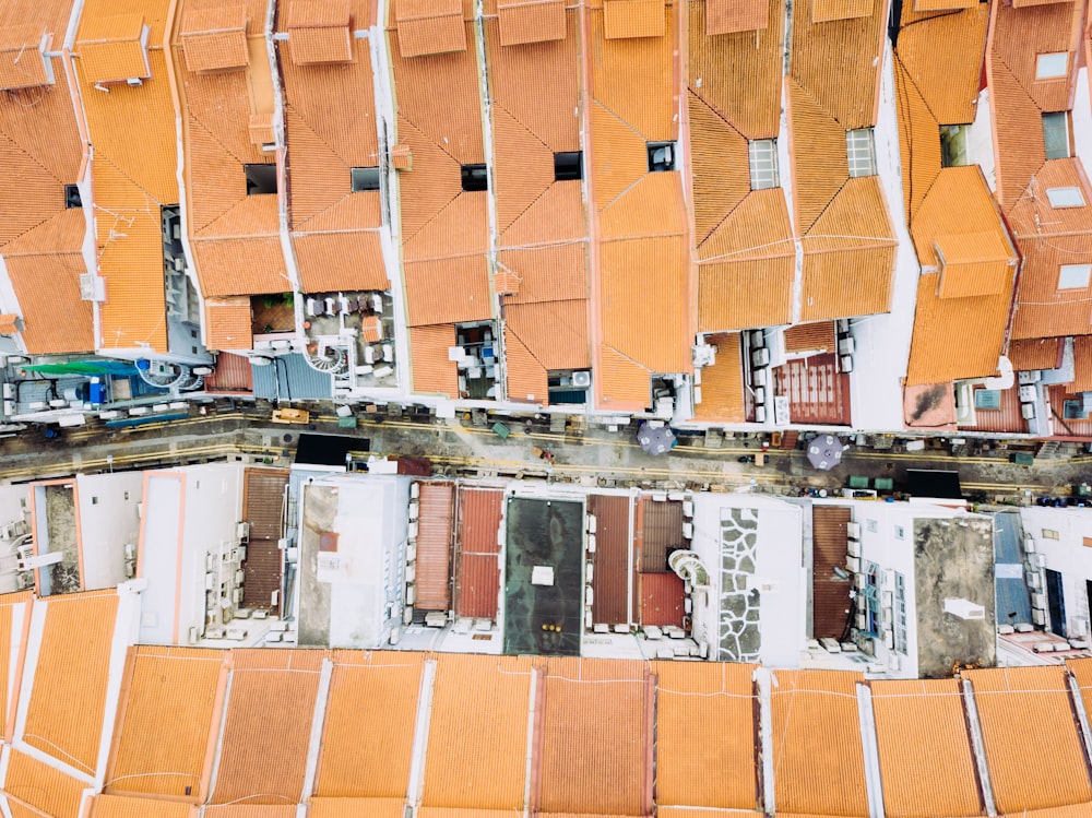 aerial photography of assorted-color house roofs at daytime