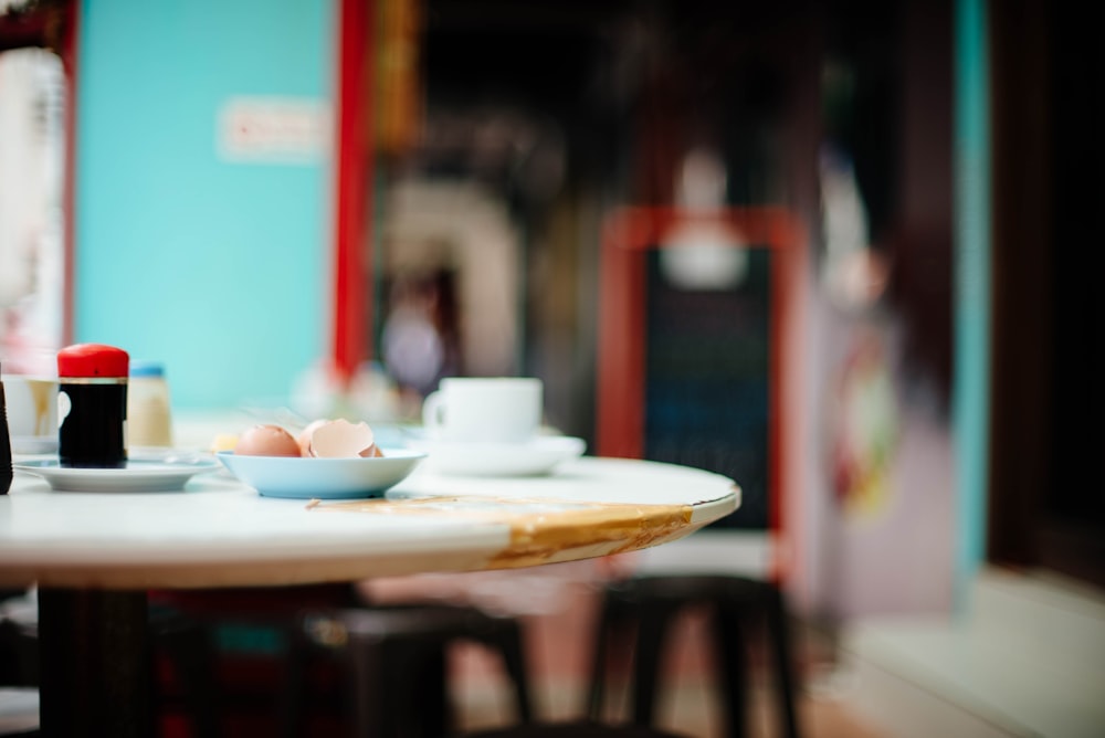 white ceramic dinnerwares on table